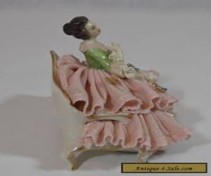 Item   DRESDEN LACE FIGURINE OF A WELL DRESSED WOMAN ON A SETTEE for Sale