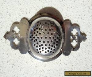 Item TEA STRAINER - ANTIQUE / VINTAGE - SILVER PLATE(?) for Sale