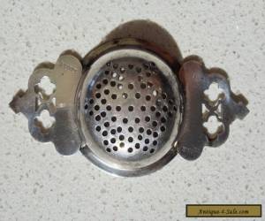 Item TEA STRAINER - ANTIQUE / VINTAGE - SILVER PLATE(?) for Sale