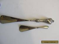 2 solid silver handled shoe horns.  birmingham 1911 and 1915