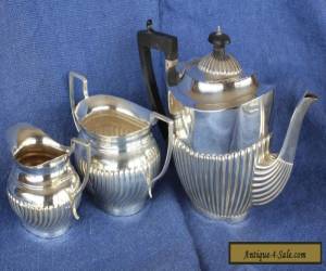 Antique hallmarked silver teapot plus an E.P. milk jug and sugar bowl.  for Sale