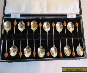 Item set of 12 silverplated coffee spoons in a box for Sale