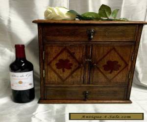 Item EARLY 20TH CENTURY  OAK TABLE CABINET - ENCLOSING A BRASS RACK for Sale