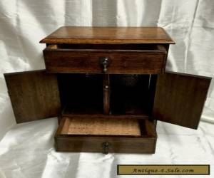 Item EARLY 20TH CENTURY  OAK TABLE CABINET - ENCLOSING A BRASS RACK for Sale