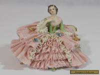  DRESDEN LACE FIGURINE OF A WELL DRESSED WOMAN ON A SETTEE