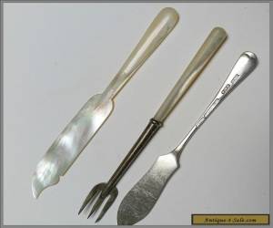 Item Sterling silver and mother of pearl pickle fork and two butter spreaders for Sale