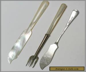 Item Sterling silver and mother of pearl pickle fork and two butter spreaders for Sale