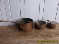 Set of 3 antique French copper saucepans