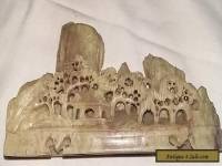 Carved Soapstone ornament showing a pagoda and mountain scene